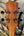 Guitar headstock with gold tuning machines on a Kanile’a Pineapple Hawaiian Koa Tenor Ukulele