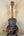 Back of a black and gray Kanile’a KPA Pro tenor ukulele with deluxe gig bag