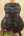 Black and gray figured wood guitar back on Kanileʻa Pōhaku T Pro Tenor Ukulele with solid maple