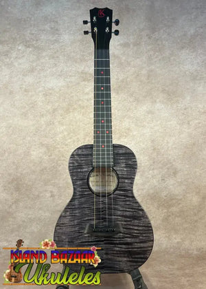 Black ukulele with red fret markers on Kanileʻa Pōhaku T Pro solid maple tenor ukulele