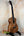 Beautiful Kanile’a K-2 Premium Koa Tenor Ukulele displayed on a black stand