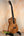 Beautiful Koa wood Kanile’a Premium Silk Tenor Ukulele K-2 on a black stand