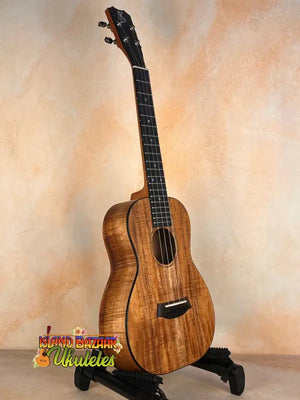 Beautiful Koa wood Kanile’a Premium Silk Tenor Ukulele K-2 on a black stand