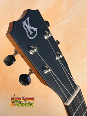 Black headstock of Kanile’a Premium Silk Tenor Ukulele K-2 with silver tuning pegs