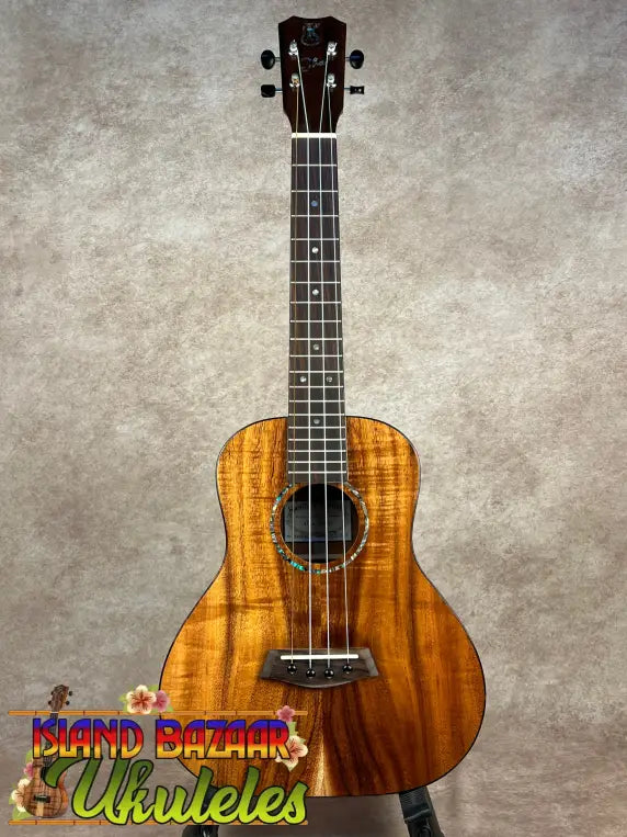 Glossy light-brown KANILE’A SUPER TENOR koa ukulele with dark fretboard and black bridge