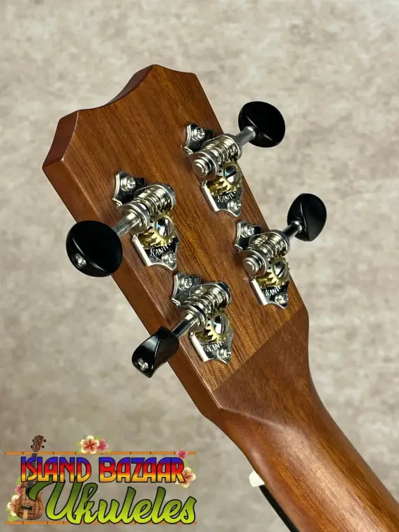 Back of Kanile’a Super Oha Series Koa Ukulele headstock with chrome tuning machines