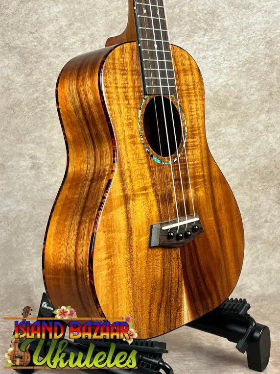 Glossy Koa wood tenor ukulele with abalone and turquoise rosette inlay, part of Kanile’a Super Oha Series
