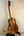 Wooden Kanile’a Super Tenor D-Hole Premium Koa Ukulele showcasing natural grain patterns