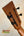 Wooden guitar headstock with black tuning pegs on Kanile’a Super Tenor Premium Koa Ukulele