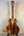 Wooden acoustic guitar showcasing natural grain in Kanile’a Super Tenor D-Hole Premium Koa Ukulele