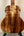 Kanile’a Super Tenor D-Hole Premium Koa Ukulele with striking tiger-stripe wood grain