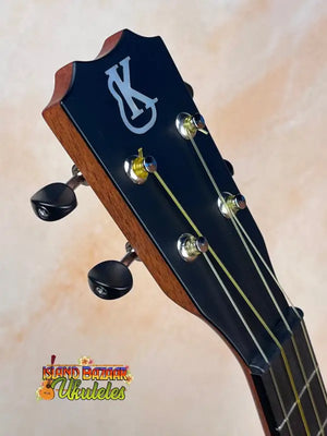 Guitar headstock with tuning pegs and K logo on Kanile’a Super Tenor Ukulele, Premium Koa