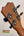 Guitar headstock with black tuning pegs and chrome hardware on Kanile’a Super Tenor Ukulele