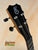 Black ukulele headstock with tuning pegs from Kanile’a Tenor D-1 with Deluxe Gig Bag