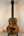 Brown wooden ukulele by Kanile’a Tenor D-1 featuring solid Hawaiian Koa in deluxe gig bag