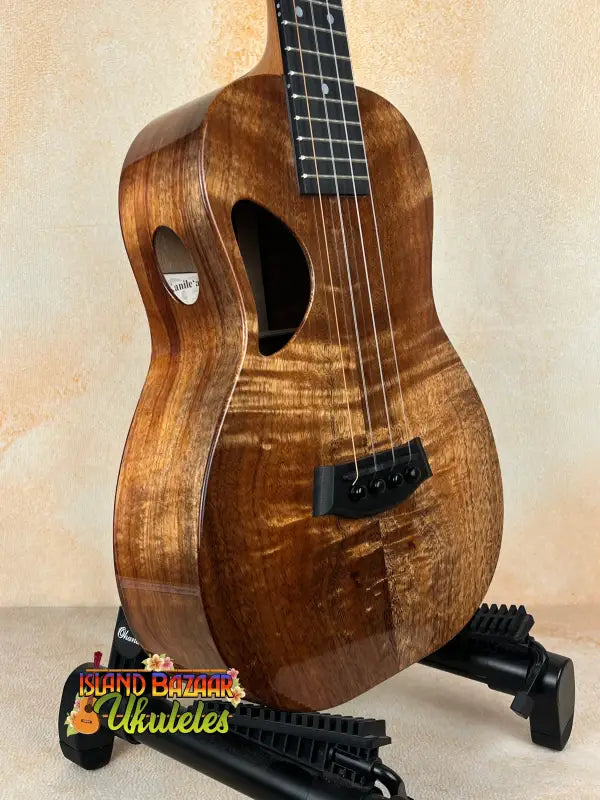 Brown wooden ukulele Kanile’a Tenor D-1 with solid Hawaiian Koa and deluxe gig bag