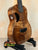 Brown wooden ukulele Kanile’a Tenor D-1 with solid Hawaiian Koa and deluxe gig bag