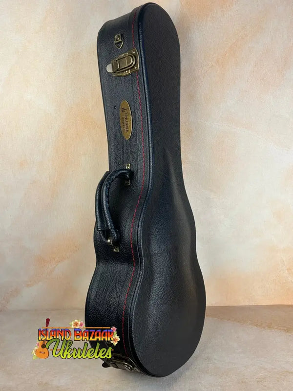 Black hardshell case with brass latches for KTM-00 Tenor Ukulele, ensuring protection and style