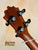 Guitar headstock with black tuning pegs on KoAloha Concert Hawaiian Ukulele, Solid Koa