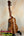 Wooden KoAloha Concert Hawaiian Ukulele in Solid Hawaiian Koa on a black stand