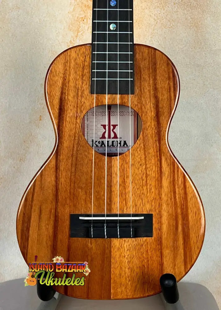 Wooden Kalilia brand Ukulele in solid Hawaiian Koa, KoAloha KCM-00 Concert, buffed high gloss