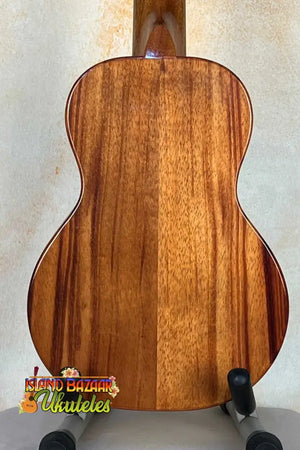 Acoustic guitar with solid Hawaiian Koa back, featured in KoAloha KCM-00 Concert Ukulele