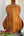 Acoustic guitar with solid Hawaiian Koa back, featured in KoAloha KCM-00 Concert Ukulele