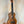 Wooden KoAloha KCM-10 Concert Ukulele in Solid Hawaiian Koa resting on a stand