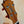 Wooden guitar headstock with tuning pegs and inlay on KoAloha KCM-10 Concert Ukulele