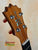 Wooden guitar headstock with tuning pegs and inlay on KoAloha KCM-10 Concert Ukulele