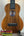 Wooden KoAloha KCM-10 Concert Ukulele in Solid Hawaiian Koa on a stand