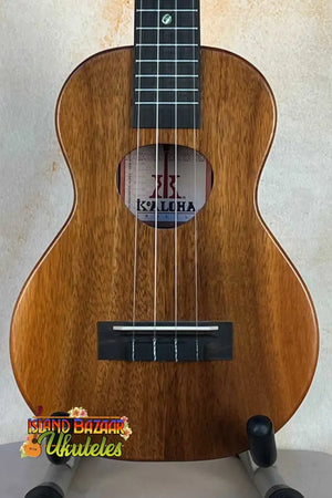 Wooden KoAloha KCM-10 Concert Ukulele in Solid Hawaiian Koa on a stand