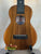 Wooden KoAloha KCM-10 Concert Ukulele in Solid Hawaiian Koa on a stand