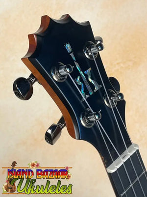 Guitar headstock with black tuning pegs on KoAloha KCM-10RP Royal Pikake Ukulele