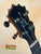 Guitar headstock with black tuning pegs on KoAloha KCM-10RP Royal Pikake Ukulele