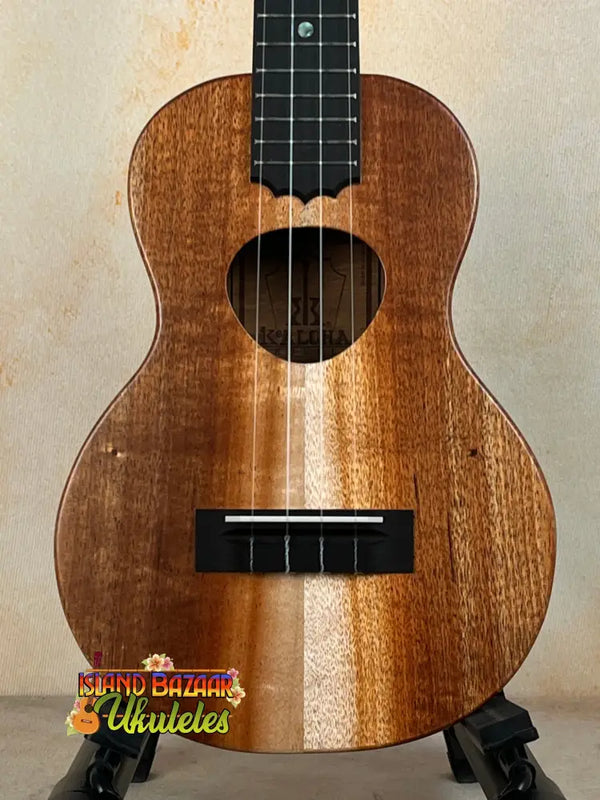 Wooden ukulele with natural finish and black fretboard, KoAloha KCM-10RP Royal Pikake