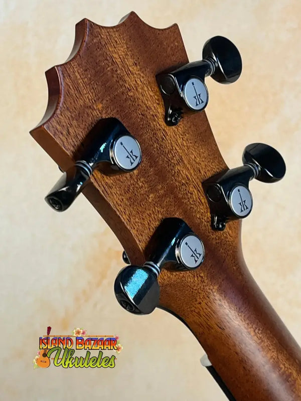 Guitar headstock with black tuning pegs and solid Hawaiian Koa featured in KoAloha KCM-10RP