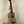 Wooden KoAloha KCM-10RP-MG Concert Ukulele in solid mango wood on a black stand