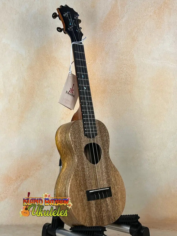 Wooden KoAloha KCM-10RP-MG Concert Ukulele in solid mango wood on a black stand