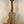 Wooden KoAlhoa KCM-10RP-MG Concert Ukulele in solid mango wood on a black stand