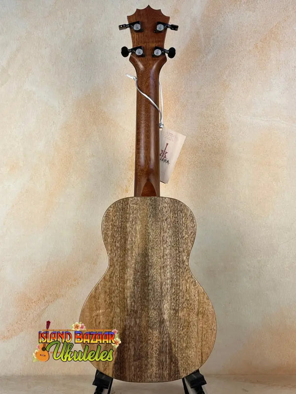 Wooden KoAlhoa KCM-10RP-MG Concert Ukulele in solid mango wood on a black stand