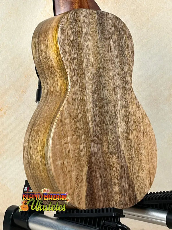 Wooden acoustic guitar highlighting natural grain, showcasing KoAloha KCM-10RP-MG Royal design