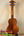 Wooden KoAloha KSM-00 featured soprano ukulele in natural finish on a black stand