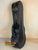 Black hardshell violin case with brass hardware and red trim for KoAloha KSM-00 ukulele