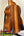 Wooden ukulele with rich brown grain on stand, featuring Hawaiian Koa and Ebony Fretboard