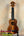 Wooden KoAloha KSM-00 Soprano Ukulele with Hawaiian Koa and Ebony Fretboard on stand