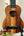 Wooden KoAloha KSM-00 Soprano Ukulele with Hawaiian Koa and Ebony Fretboard on stand
