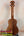 Wooden ukulele with striped grain, showcasing the KoAloha KSM-10 Soprano Ukulele’s Pikake Satin Finish