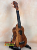 Wooden KoAloha KSM-10 Soprano Ukulele with dark grain and Pikake Satin Finish on stand