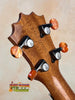 Guitar headstock with amber tuning knobs on KoAloha KSM-10 Soprano Ukulele in Pikake Satin Finish